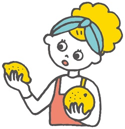 レモンとグレープフルーツを手に持って見ている人のイラスト