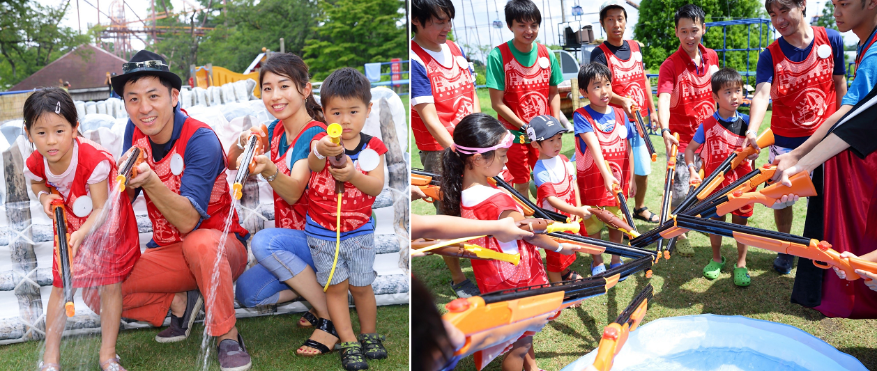 子どもから大人まで、水鉄砲を持ってゲームを楽しんでいる様子
