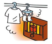ストーブの近くに洗濯物を干しているイラスト