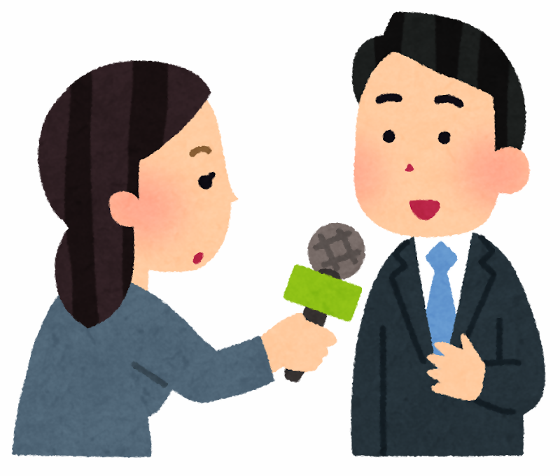 インタビューを受ける男性の画像